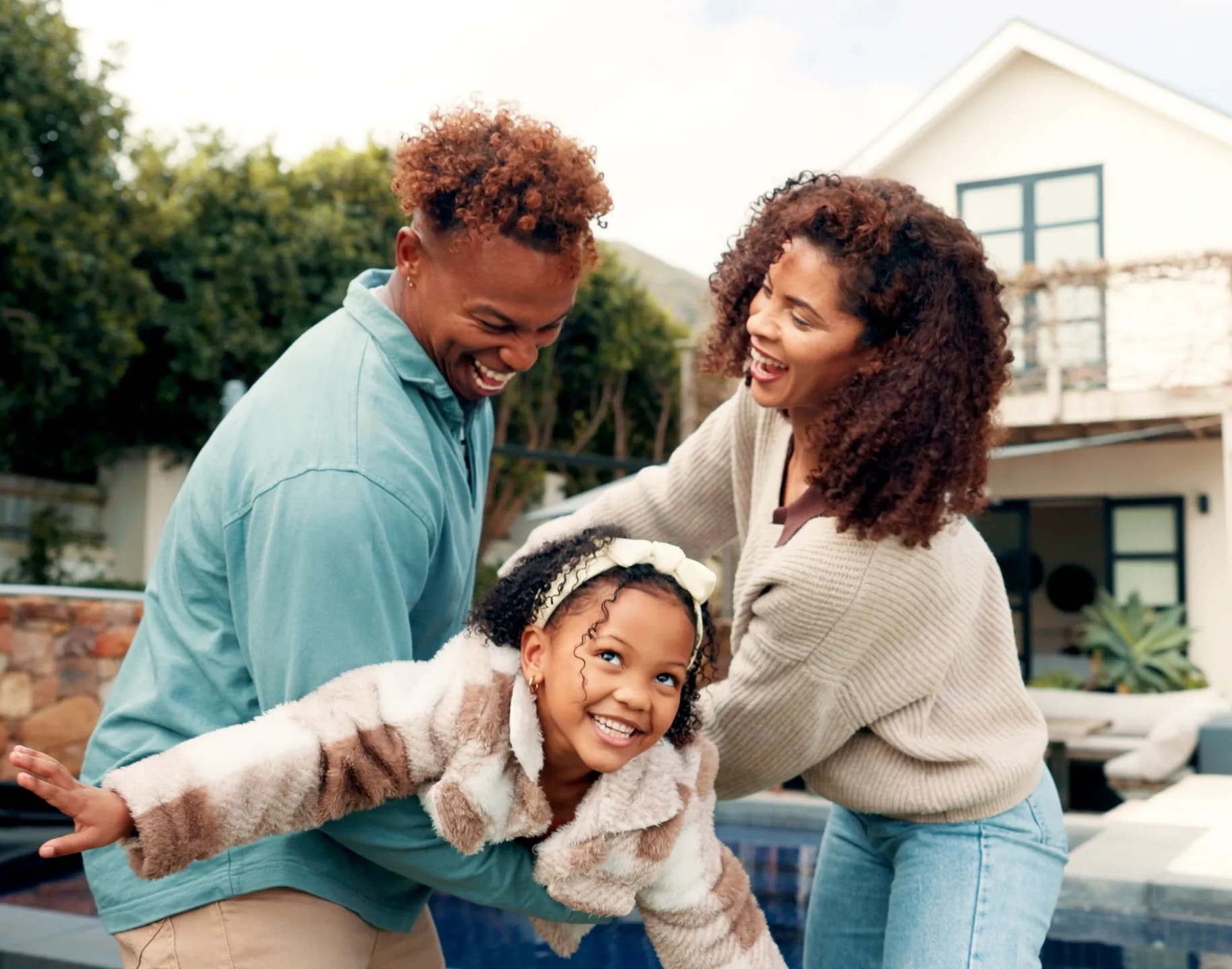 Family laughing together outdoors